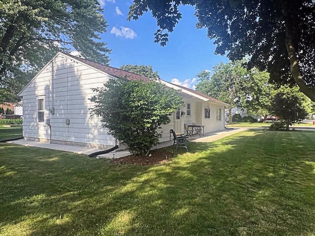 12308 W Walker St, West Allis, WI 53214 - view of home's exterior with a lawn
