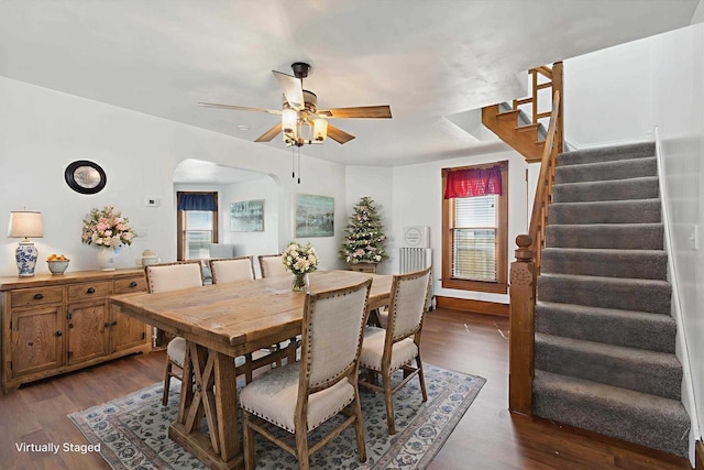 717 Portland Ave, Beloit, WI 53511 - dining space with stairway, ceiling fan, arched walkways, and dark wood-type flooring