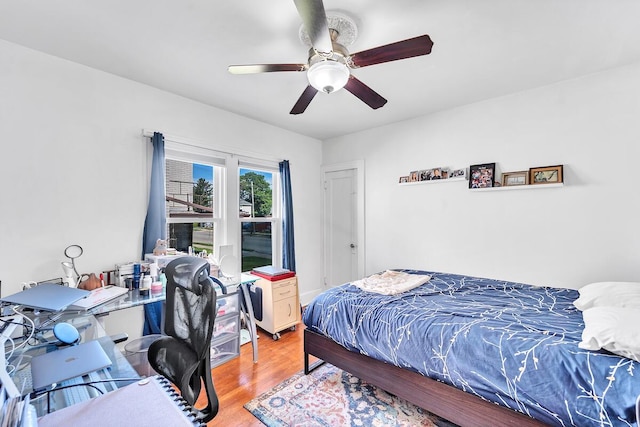2813 21st St, Racine, WI 53403 - bedroom with wood finished floors, a desk, and a ceiling fan