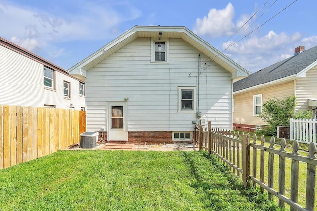 2813 21st St, Racine, WI 53403 - back of house featuring entry steps and a fenced backyard