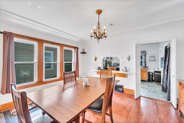 2813 21st St, Racine, WI 53403 - dining room with a chandelier and light wood-style flooring