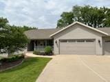 2309 E Pine Tree Ct, Milton, WI 53563 - single story home with a garage, driveway, and a front lawn