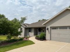 2309 E Pine Tree Ct, Milton, WI 53563 - ranch-style home featuring driveway and an attached garage