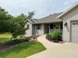 2309 E Pine Tree Ct, Milton, WI 53563 - ranch-style house with a garage, driveway, and a front yard