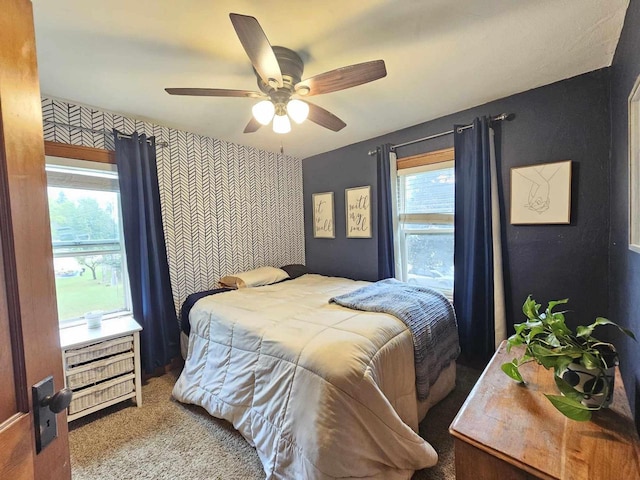 556 E Jefferson St, Waupun, WI 53963 - carpeted bedroom featuring an accent wall and a ceiling fan