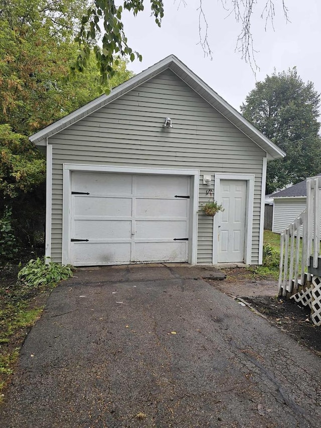 556 E Jefferson St, Waupun, WI 53963 - detached garage featuring driveway