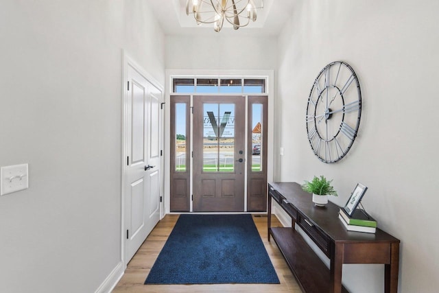 1104 Winn Dr, Waunakee, WI 53597 - entrance foyer with a chandelier and light wood finished floors