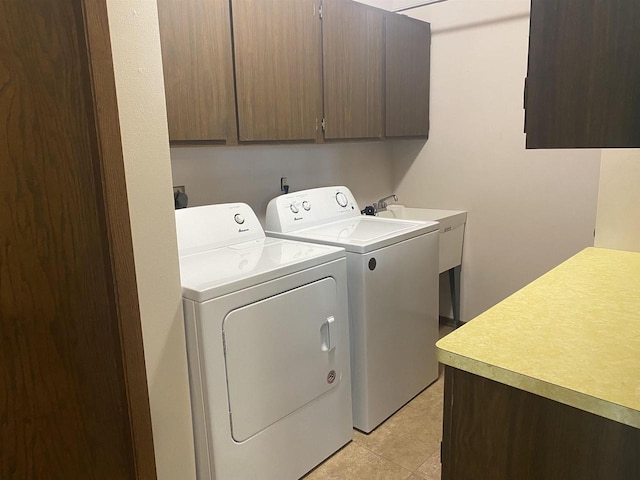 5572 Stable View Ln, Fitchburg, WI 53575 - laundry room with cabinet space, washing machine and clothes dryer, and light tile patterned floors