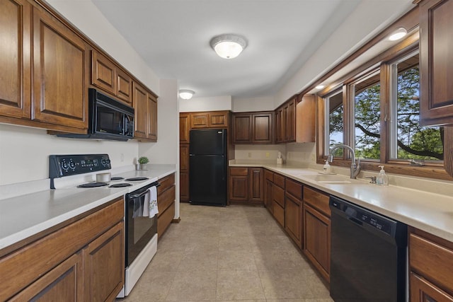 5572 Stable View Ln, Fitchburg, WI 53575 - kitchen featuring black appliances and light countertops