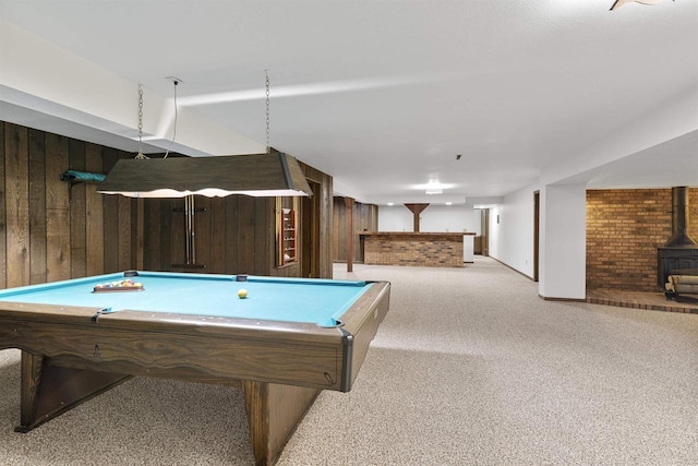 5572 Stable View Ln, Fitchburg, WI 53575 - playroom featuring wood walls, a wood stove, carpet flooring, pool table, and bar