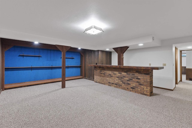 5572 Stable View Ln, Fitchburg, WI 53575 - finished basement with carpet, a bar, wooden walls, and recessed lighting