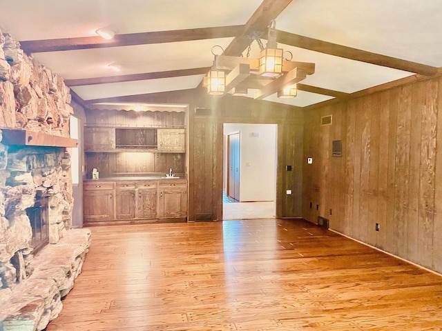5572 Stable View Ln, Fitchburg, WI 53575 - unfurnished living room with wooden walls and light wood-style floors