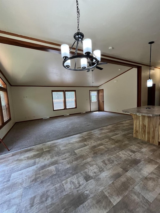 N13403 US Highway 141, Wausaukee, WI 54177 - unfurnished living room featuring a chandelier, dark carpet, and ceiling fan