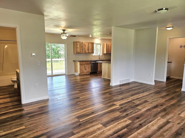 1209 E 15th St, Marshfield, WI 54449 - unfurnished living room featuring ceiling fan and dark wood-type flooring