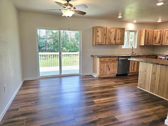1209 E 15th St, Marshfield, WI 54449 - kitchen with dishwasher, dark countertops, ceiling fan, dark wood-style flooring, and recessed lighting