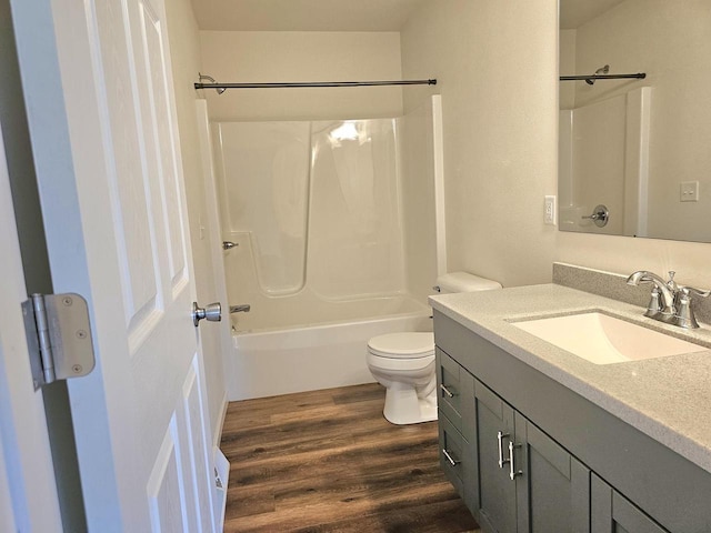 1209 E 15th St, Marshfield, WI 54449 - full bath featuring vanity, shower / bath combination, and wood finished floors