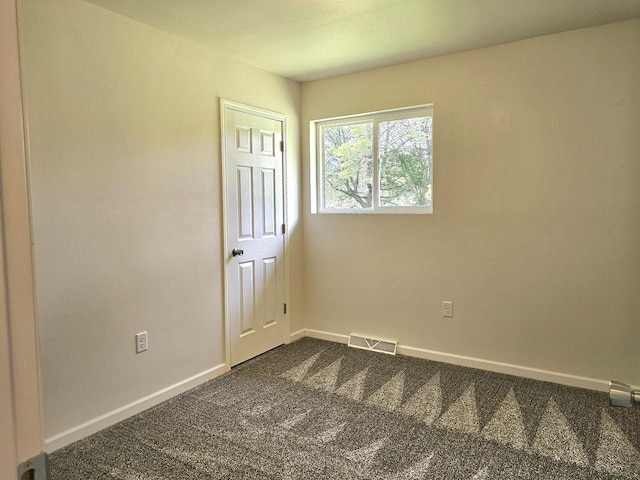 1209 E 15th St, Marshfield, WI 54449 - empty room with dark colored carpet and baseboards