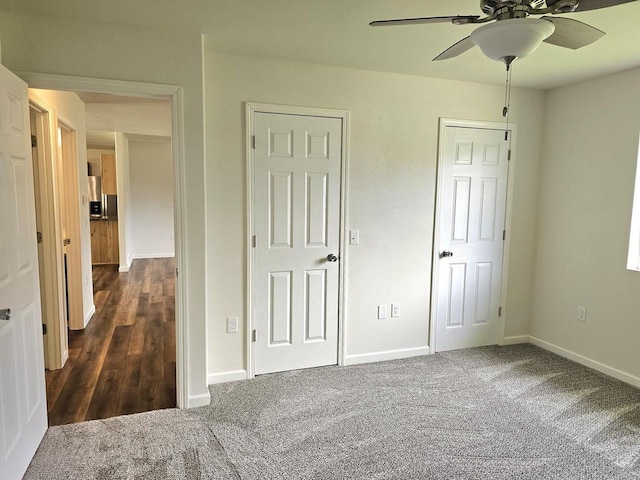 1209 E 15th St, Marshfield, WI 54449 - unfurnished bedroom with dark colored carpet and ceiling fan