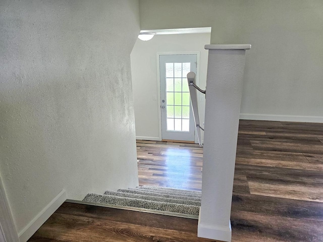 1209 E 15th St, Marshfield, WI 54449 - staircase featuring wood finished floors and a textured wall