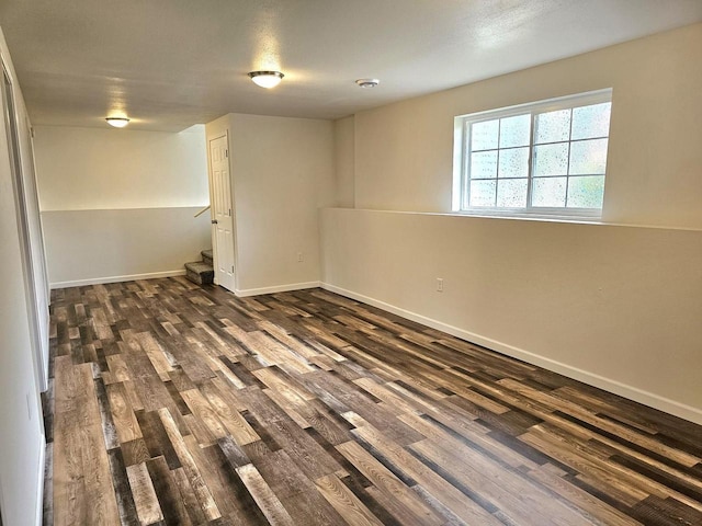 1209 E 15th St, Marshfield, WI 54449 - below grade area with dark wood-style floors and baseboards