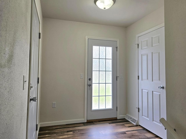 1209 E 15th St, Marshfield, WI 54449 - doorway with dark wood-style floors and baseboards