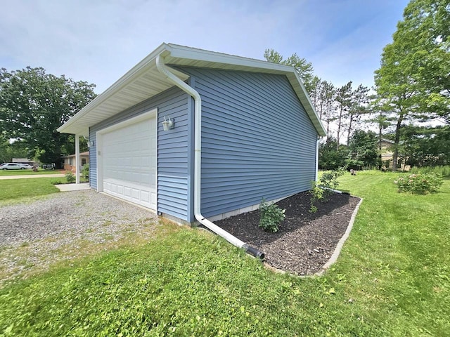 1209 E 15th St, Marshfield, WI 54449 - view of side of property with a lawn, an outbuilding, and driveway