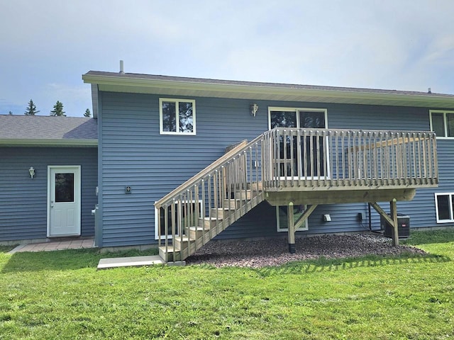 1209 E 15th St, Marshfield, WI 54449 - back of house featuring a yard, a deck, and stairs