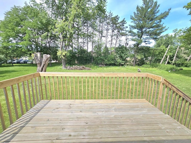 1209 E 15th St, Marshfield, WI 54449 - wooden terrace featuring a lawn and view of wooded area
