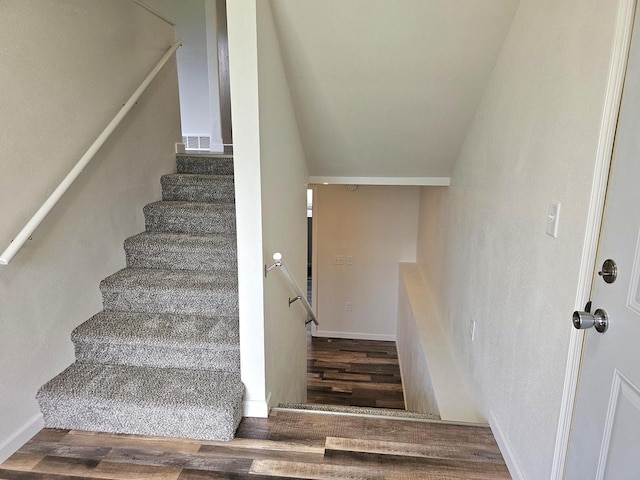 1209 E 15th St, Marshfield, WI 54449 - stairway featuring wood finished floors and lofted ceiling