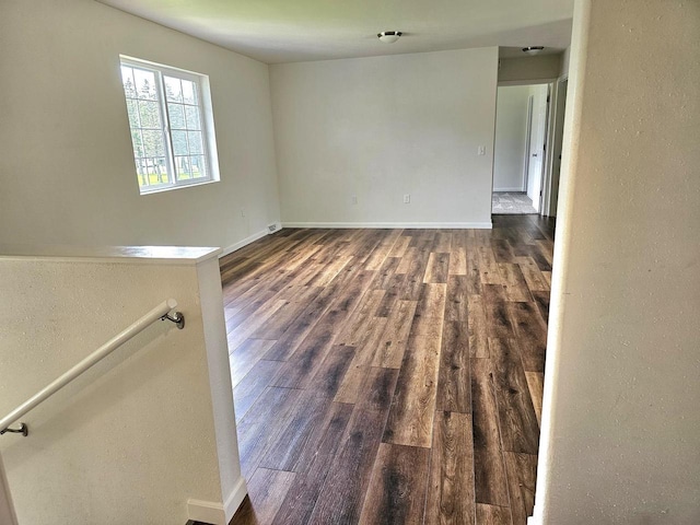 1209 E 15th St, Marshfield, WI 54449 - spare room featuring dark wood-type flooring