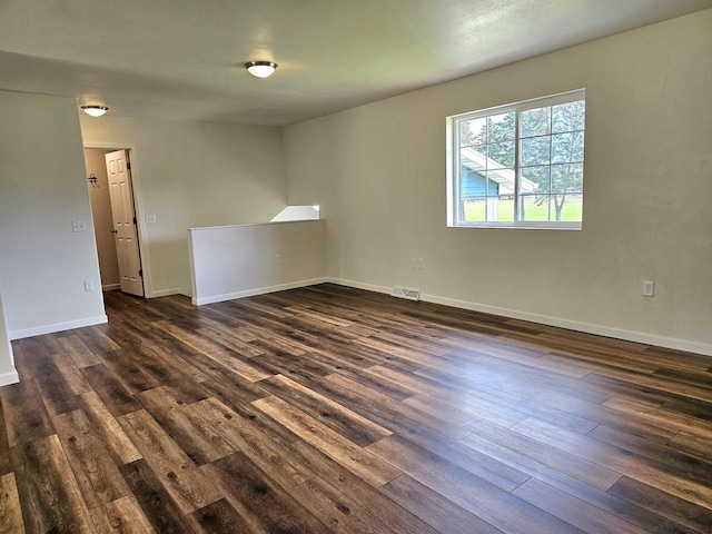 1209 E 15th St, Marshfield, WI 54449 - spare room with dark wood-style floors and baseboards