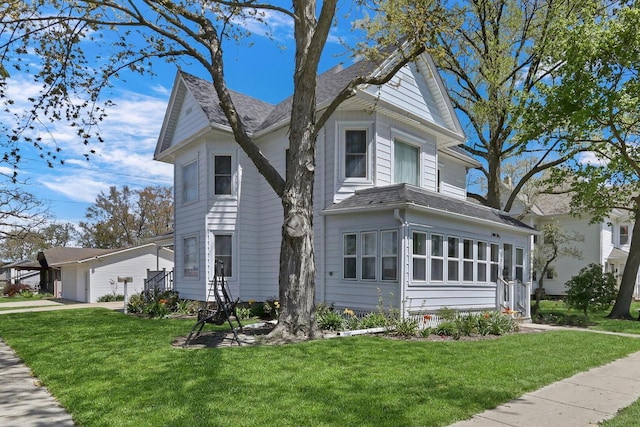 822 12th Ave, Union Grove, WI 53182 - view of side of home featuring a lawn and a shingled roof