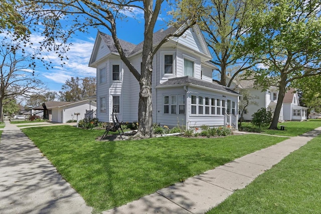 822 12th Ave, Union Grove, WI 53182 - view of home's exterior featuring a lawn, a garage, and a shingled roof