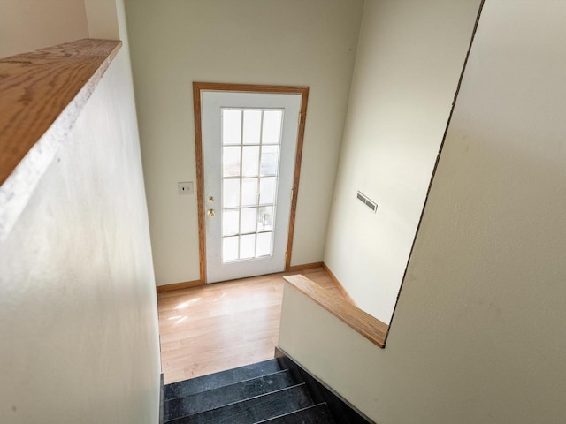 1010 Orchard Dr, Manitowoc, WI 54220 - stairs with baseboards and wood finished floors