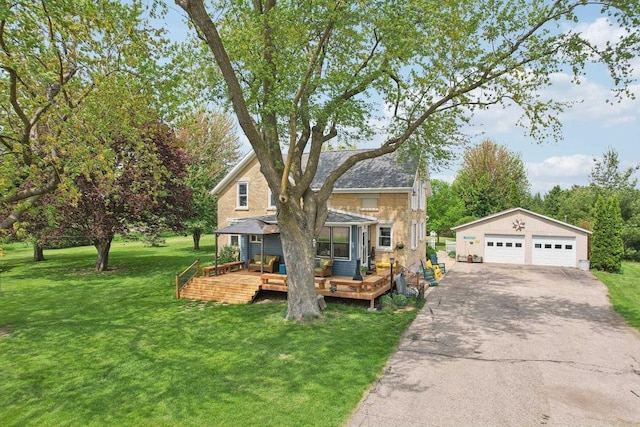 N5562 County Road A, Lake Mills, WI 53551 - view of front of property with a garage, a deck, an outdoor structure, and a front yard