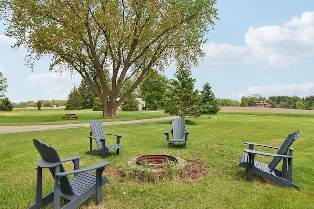 N5562 County Road A, Lake Mills, WI 53551 - view of community with a fire pit and a yard
