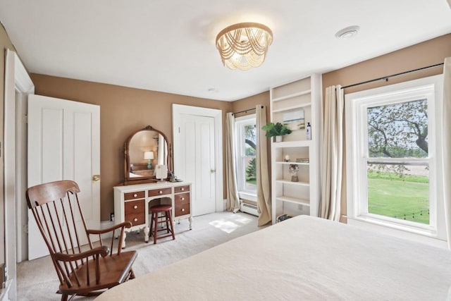 N5562 County Road A, Lake Mills, WI 53551 - bedroom featuring a chandelier, light colored carpet, and a baseboard radiator