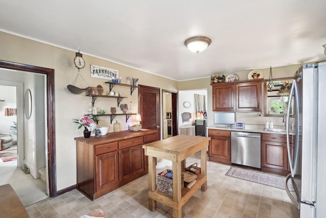 N5562 County Road A, Lake Mills, WI 53551 - kitchen featuring appliances with stainless steel finishes, crown molding, and open shelves