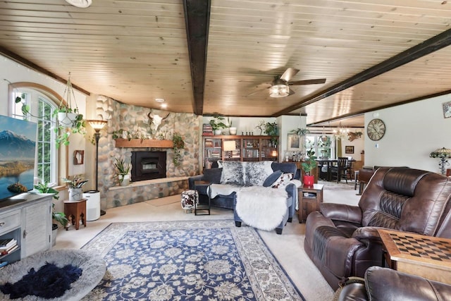 N5562 County Road A, Lake Mills, WI 53551 - living room with a wood ceiling with exposed beams, a stone fireplace, and a ceiling fan