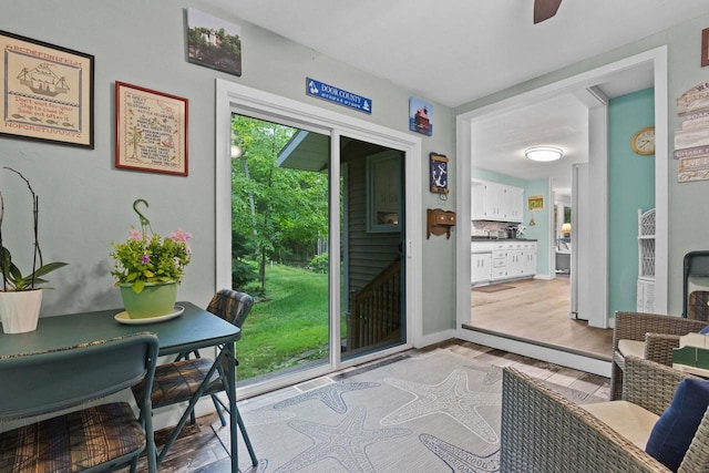 6170 Bay Shore Dr, Sturgeon Bay, WI 54235 - doorway to outside with light wood finished floors and a ceiling fan