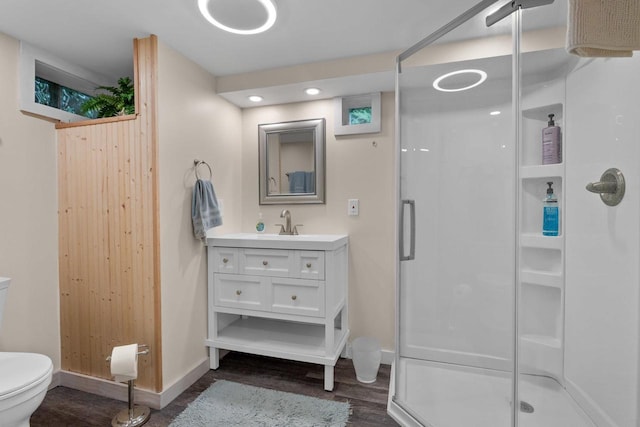 6170 Bay Shore Dr, Sturgeon Bay, WI 54235 - full bath featuring a stall shower, vanity, and wood finished floors