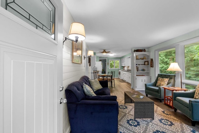 6170 Bay Shore Dr, Sturgeon Bay, WI 54235 - living area featuring light wood-style flooring and ceiling fan