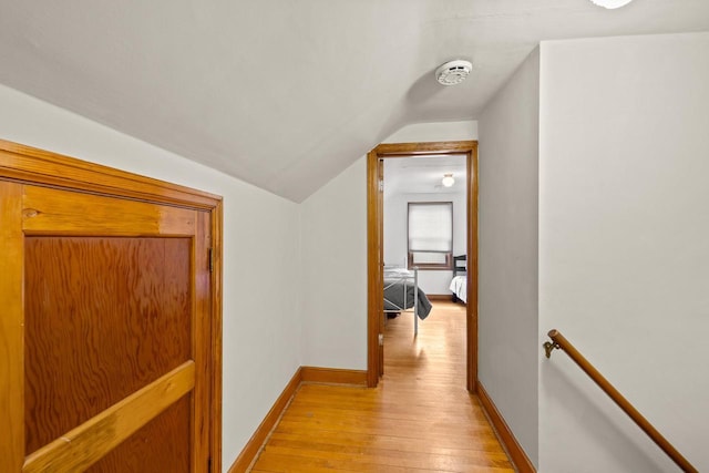 1240 Franklin St, Wisconsin Rapids, WI 54494 - hall featuring light wood finished floors, lofted ceiling, and an upstairs landing