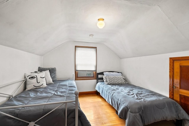 1240 Franklin St, Wisconsin Rapids, WI 54494 - bedroom featuring wood finished floors and lofted ceiling
