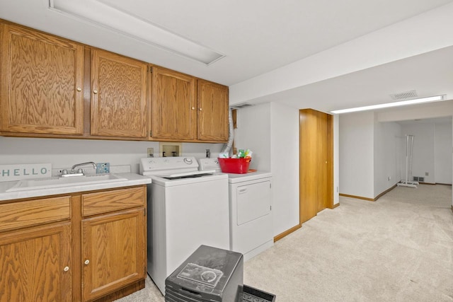 1240 Franklin St, Wisconsin Rapids, WI 54494 - laundry area with washing machine and dryer, light colored carpet, and cabinet space