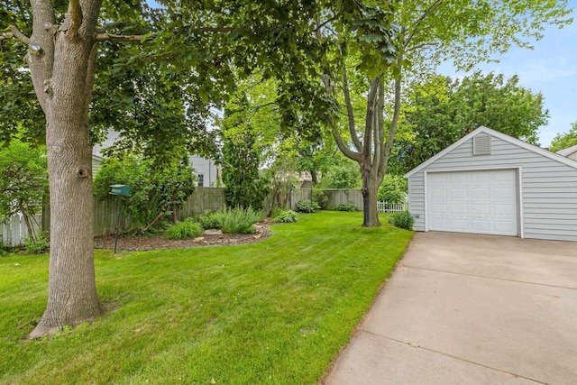 1240 Franklin St, Wisconsin Rapids, WI 54494 - view of yard featuring an outbuilding, driveway, and a garage