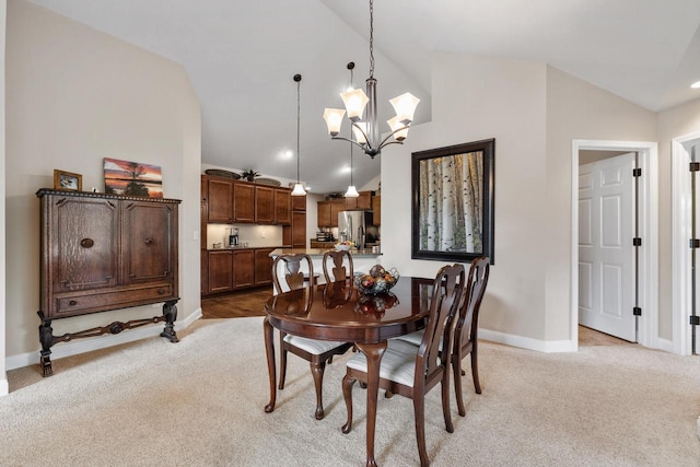 1040 Ann Marie Way, Oconomowoc, WI 53066 - dining area with light carpet, a chandelier, high vaulted ceiling, and recessed lighting