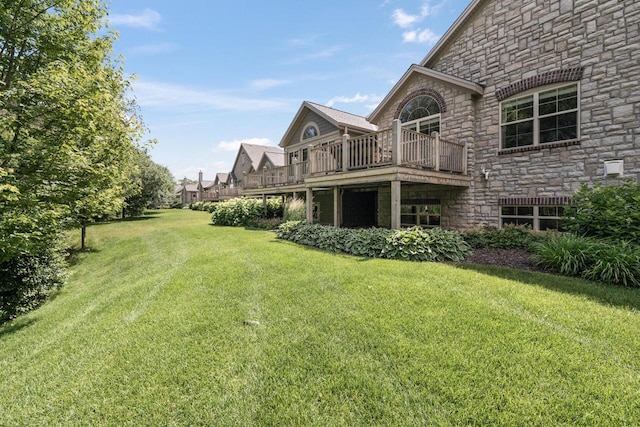 1040 Ann Marie Way, Oconomowoc, WI 53066 - view of grassy yard featuring a balcony and a wooden deck