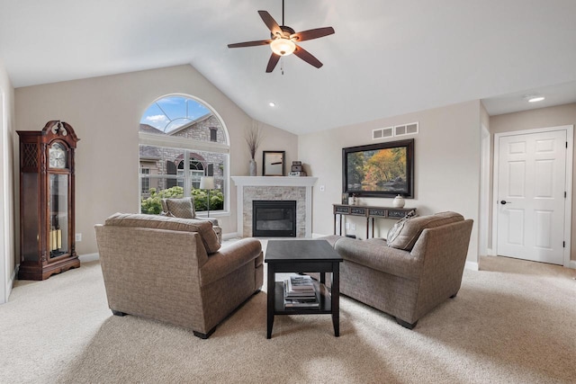 1040 Ann Marie Way, Oconomowoc, WI 53066 - living area featuring light carpet, a ceiling fan, lofted ceiling, a glass covered fireplace, and recessed lighting