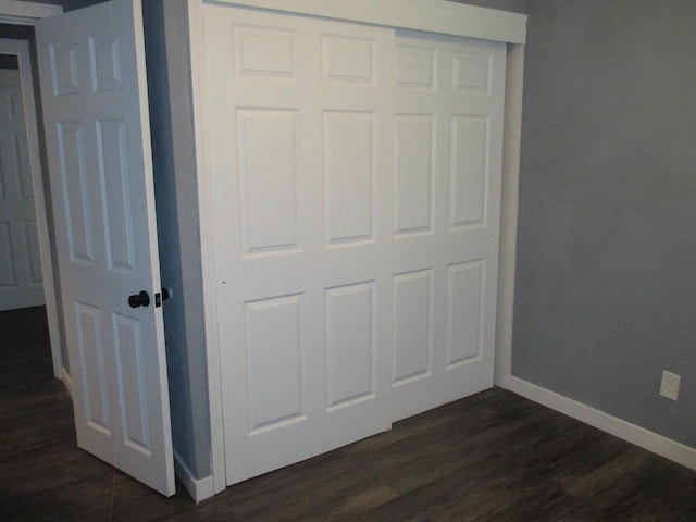 2116 W Atkinson Ave Unit 2116A, Milwaukee, WI 53209 - unfurnished bedroom with dark wood finished floors and a closet